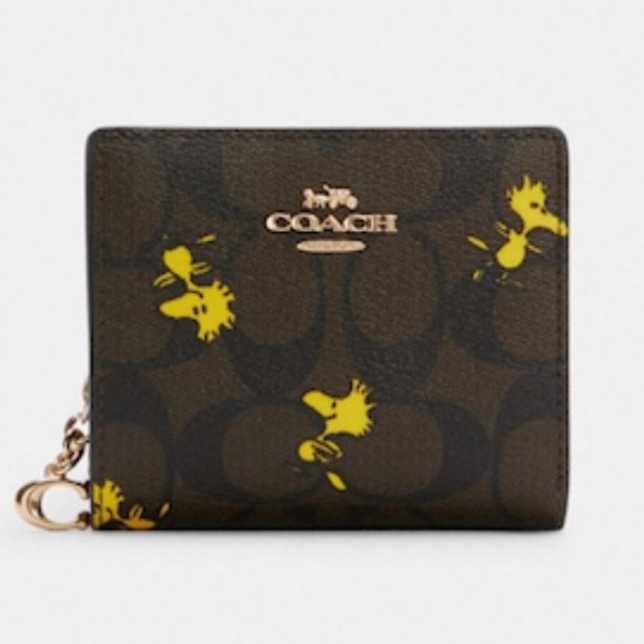 Coach Handbags - Coach X Peanuts Snap Wallet In Signature Canvas With Woodstock Print